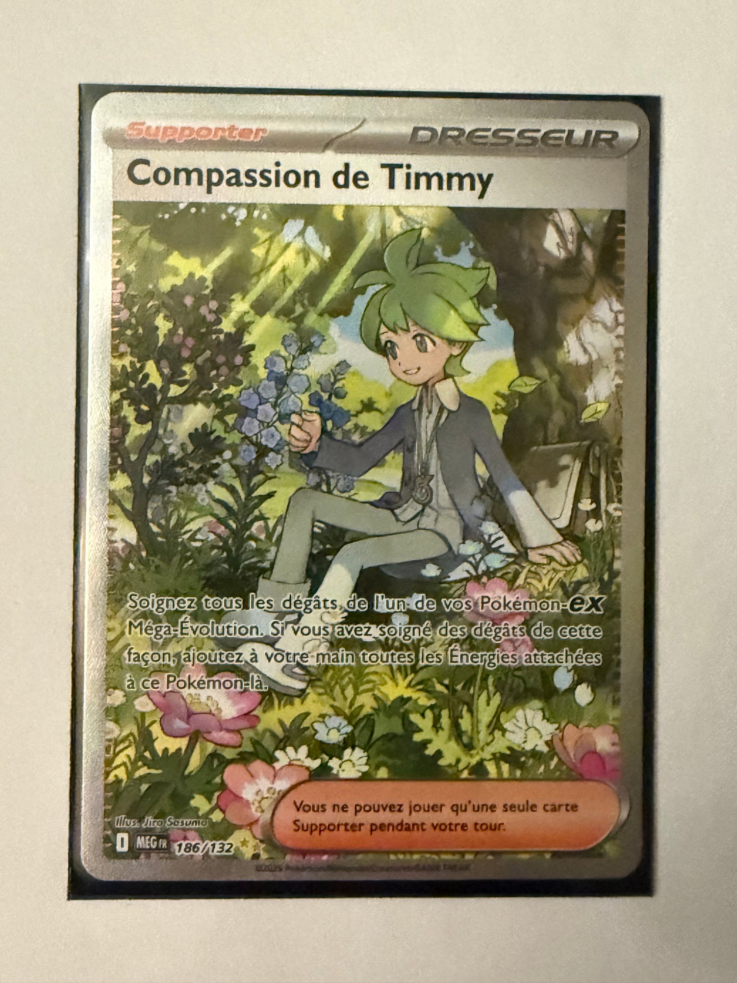 Carte Pokémon ALT compassion de Timmy (Me1 186) Mint Française + 1 carte mystère